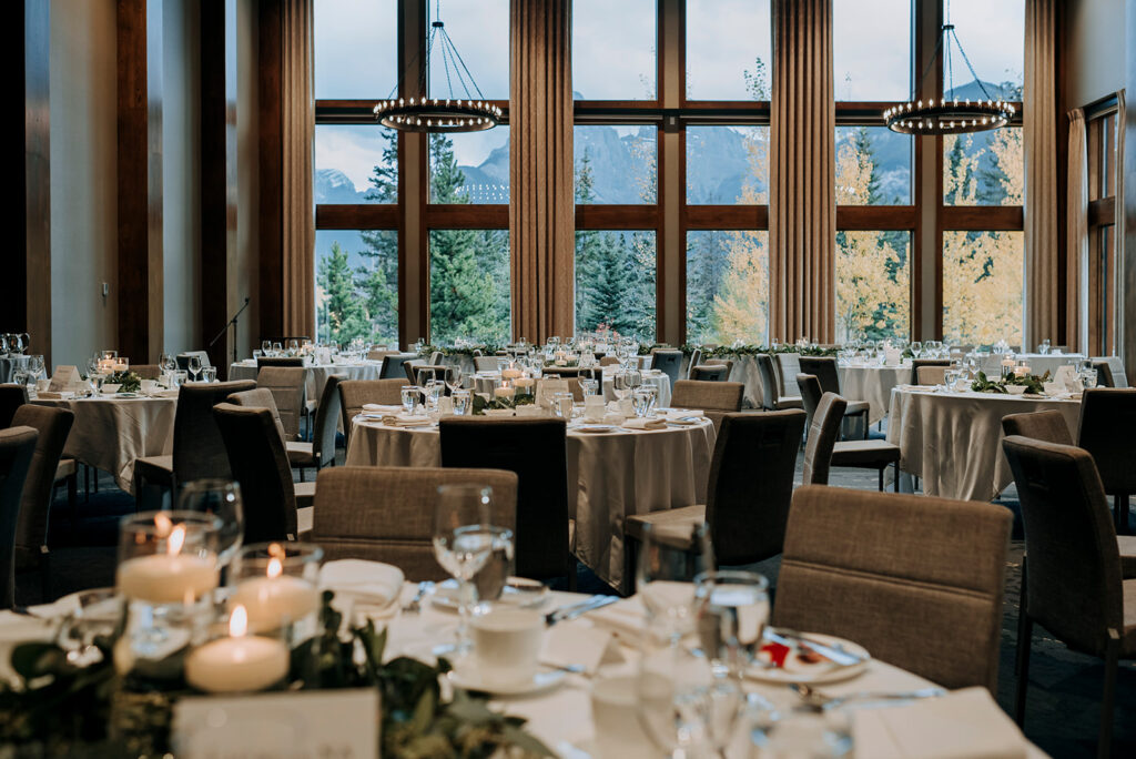 Wedding reception space at the Malcolm Hotel in Canmore. Tables are set with glasswear.